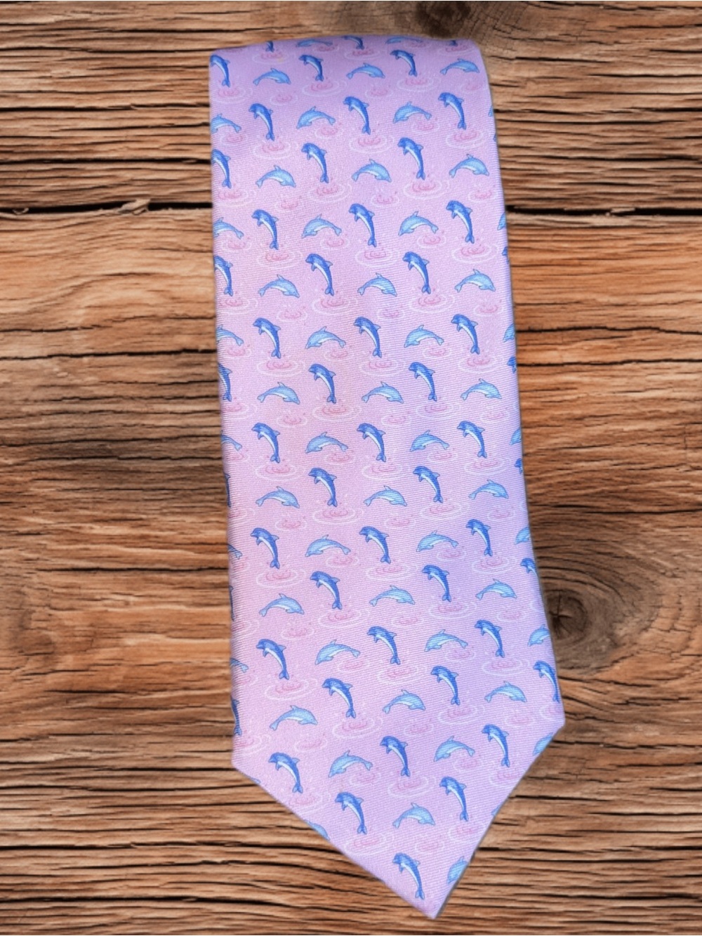 Pink Tommy Hilfiger silk conversational tie featuring a dolphin pattern